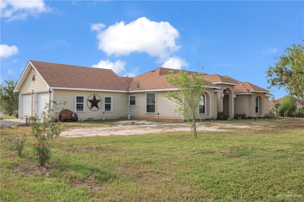 715 North Gonzalez Road Weslaco, TX 78596 - Photo 20 of 31 a front view of a house with a yard