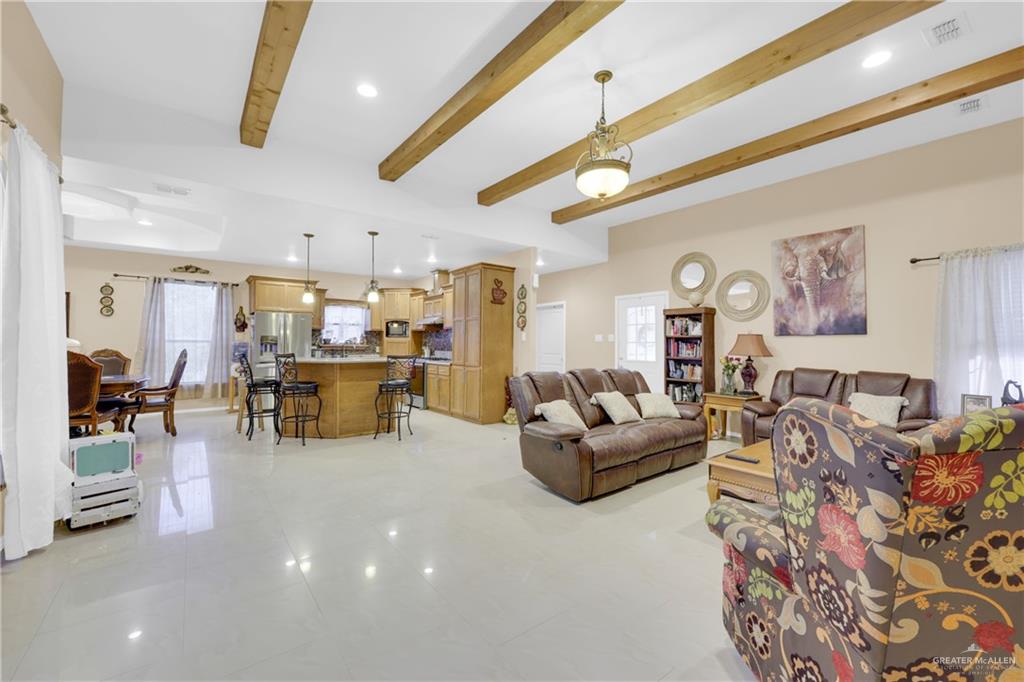 715 North Gonzalez Road Weslaco, TX 78596 - Photo 2 of 31 a living room with furniture and kitchen view