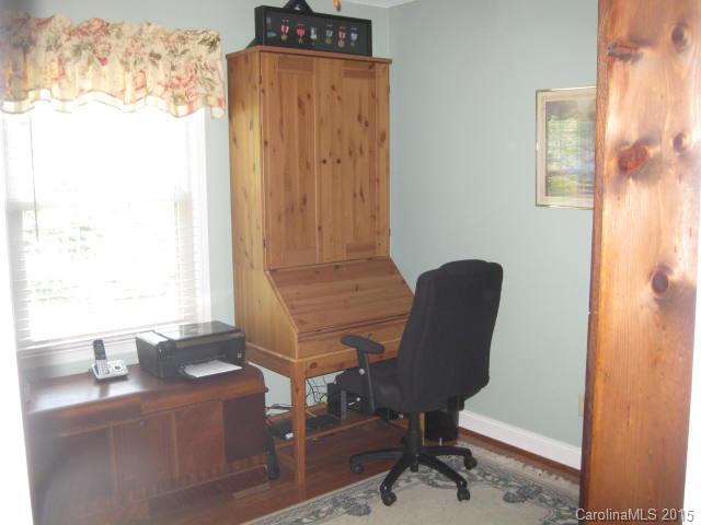 635 Miles Road Dallas, NC 28034 - Photo 11 of 17 a view of a workspace with furniture and a window