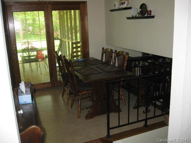 635 Miles Road Dallas, NC 28034 - Photo 17 of 17 a dining room with furniture and a floor to ceiling window