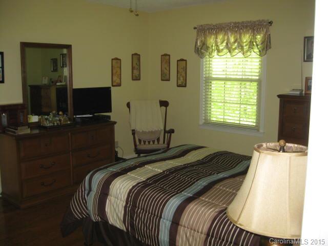 635 Miles Road Dallas, NC 28034 - Photo 7 of 17 a bedroom with a bed and a window