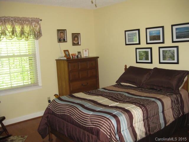 635 Miles Road Dallas, NC 28034 - Photo 8 of 17 a bedroom with a bed and a window