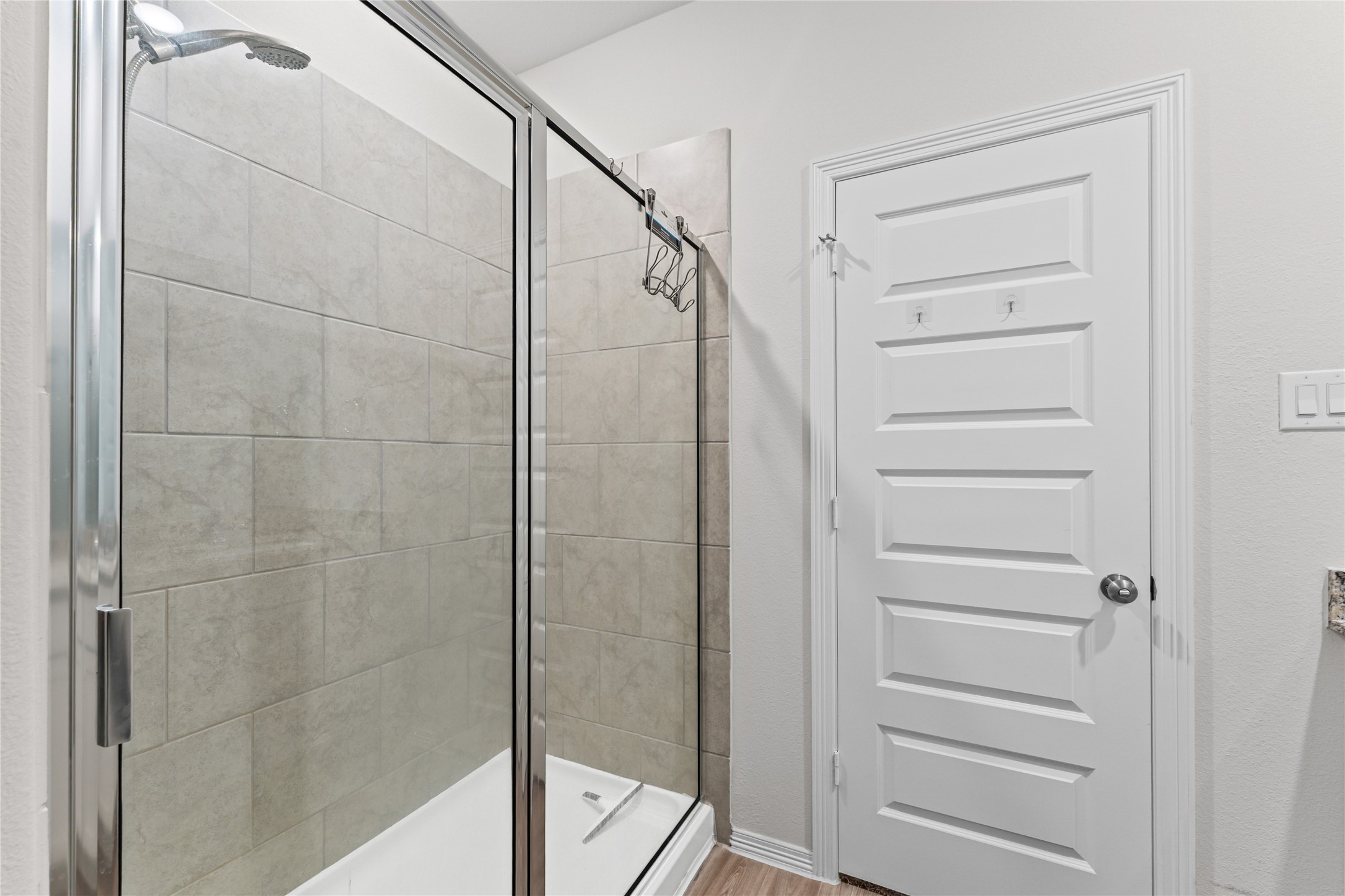 23326 Spring Genesis Lane Katy, TX 77493 - Photo 16 of 32 The modern finishes and bright atmosphere make this ensuite a truly private retreat within the home.