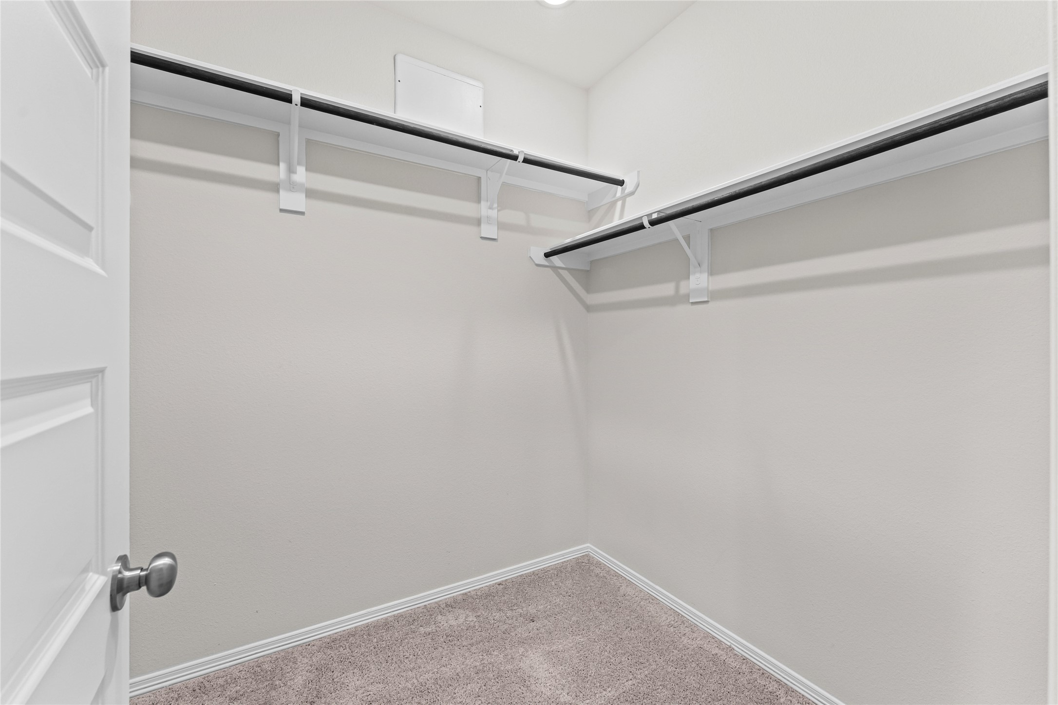 23326 Spring Genesis Lane Katy, TX 77493 - Photo 17 of 32 Tucked away within the primary suite is an incredibly spacious walk-in closet that is a dream for any wardrobe enthusiast. With abundant hanging space and room for organization, it effortlessly accommodates everything from seasonal attire to your favorite accessories.