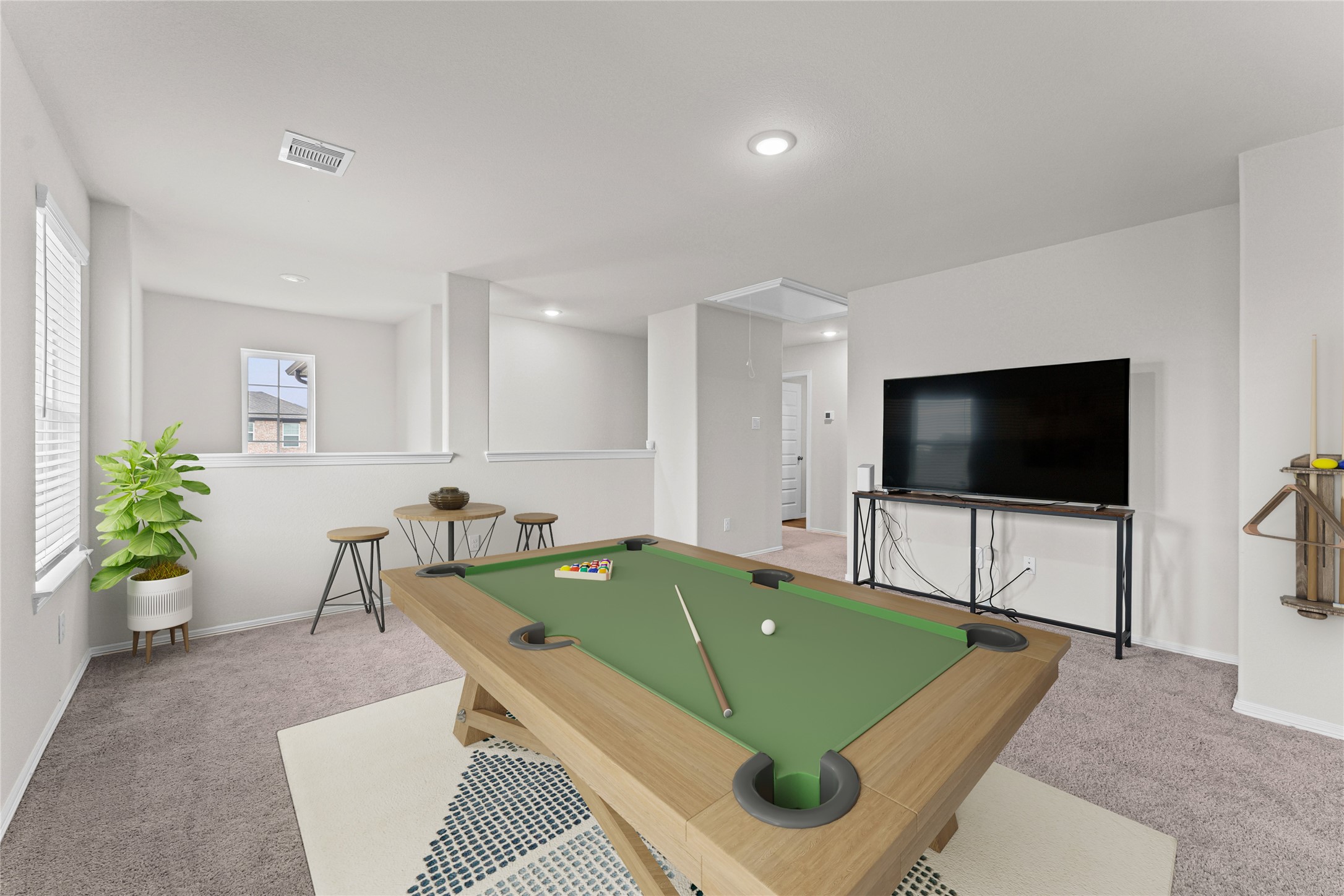 23326 Spring Genesis Lane Katy, TX 77493 - Photo 19 of 32 Head upstairs to discover a massive game room featuring plush carpet flooring that is ready for movie nights or a play area.