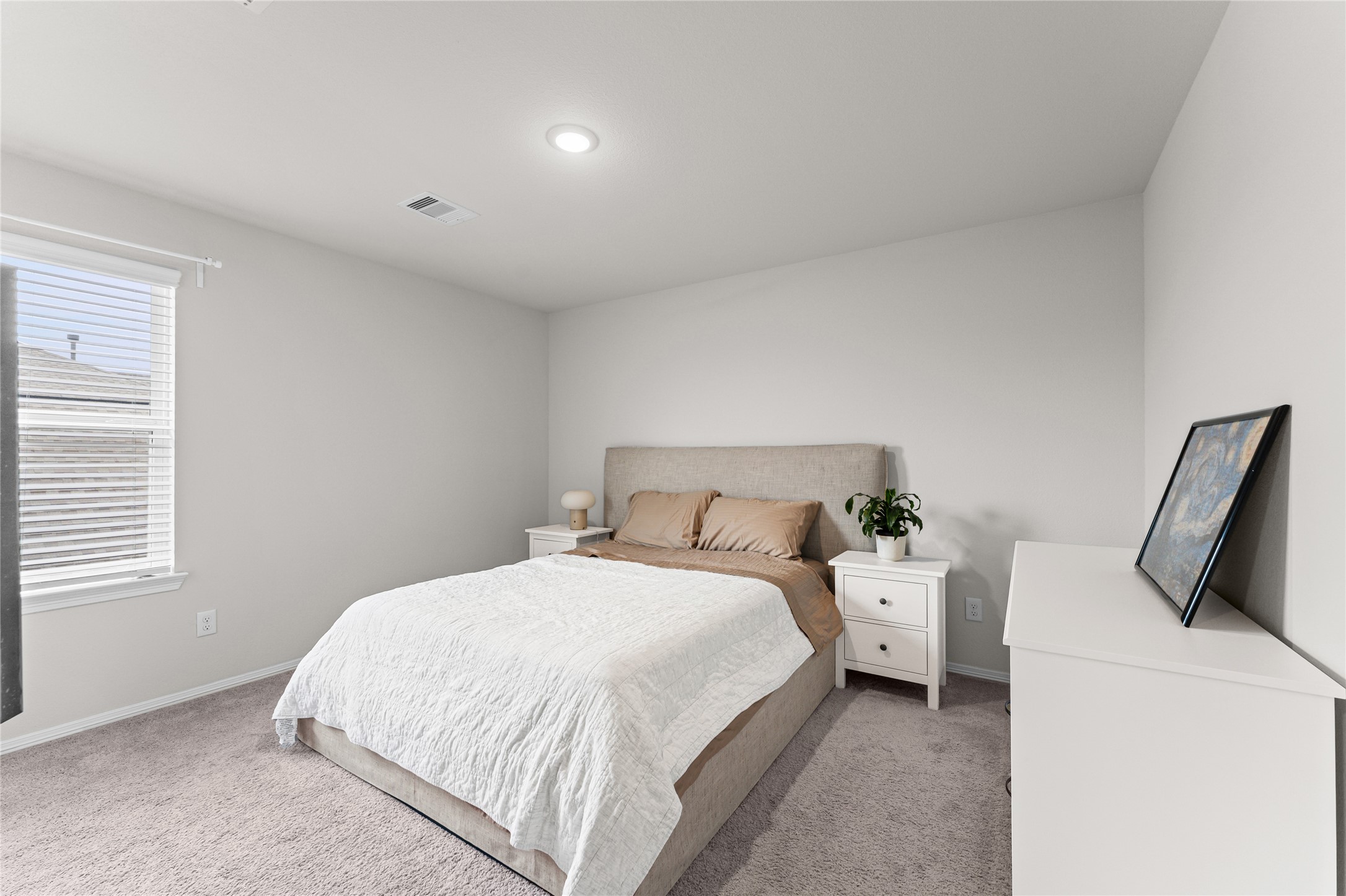 23326 Spring Genesis Lane Katy, TX 77493 - Photo 20 of 32 The third bedroom is a bright and airy haven, boasting large windows that fill the space with cheerful natural light. With plush carpet flooring and a generous layout, it offers plenty of room for additional furniture.