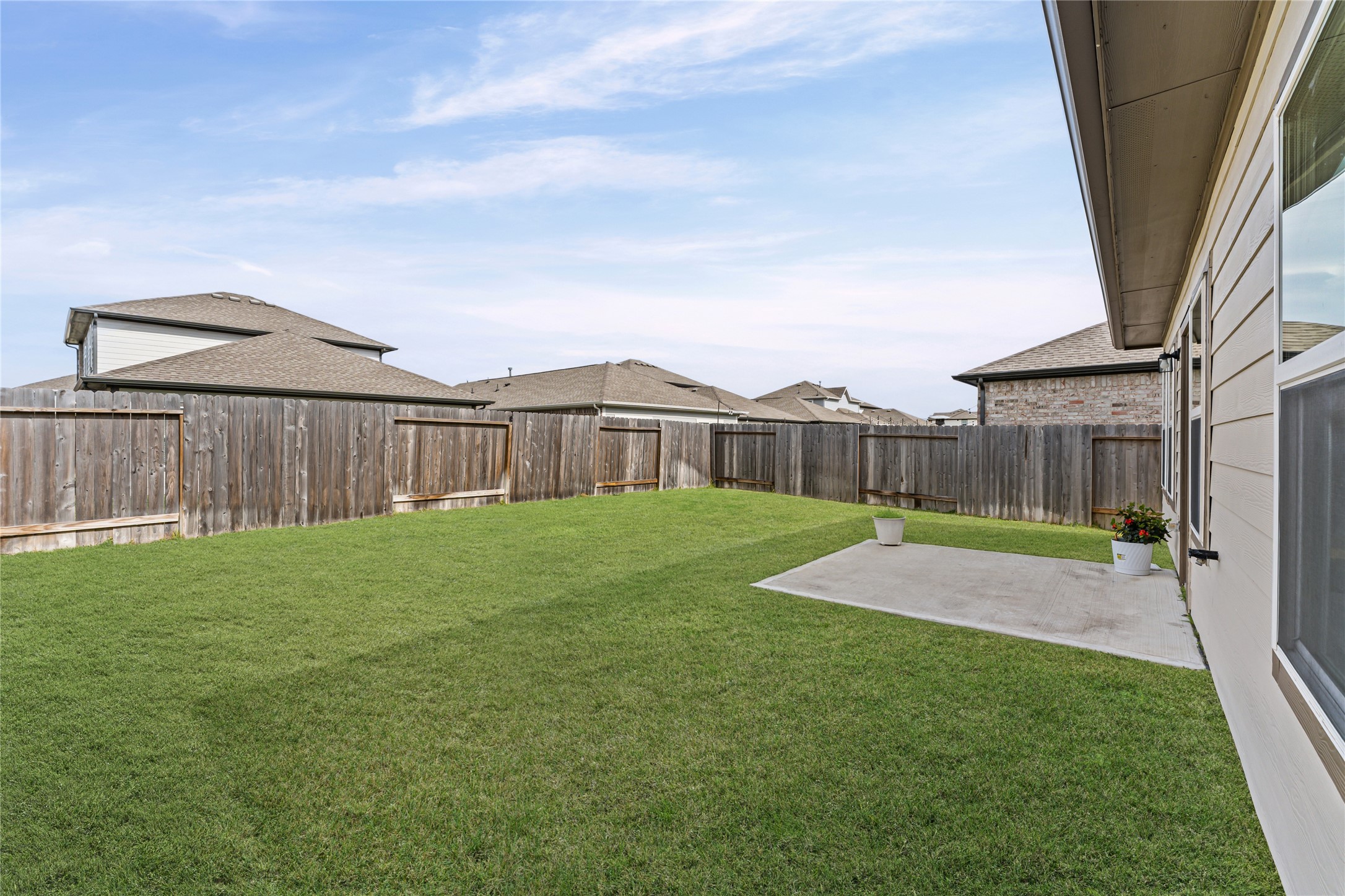 23326 Spring Genesis Lane Katy, TX 77493 - Photo 28 of 32 The massive backyard offers a blank canvas for your outdoor dreams, whether you envision a playground or a lush garden oasis.