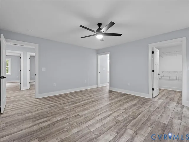 a view of an empty room and wooden floor