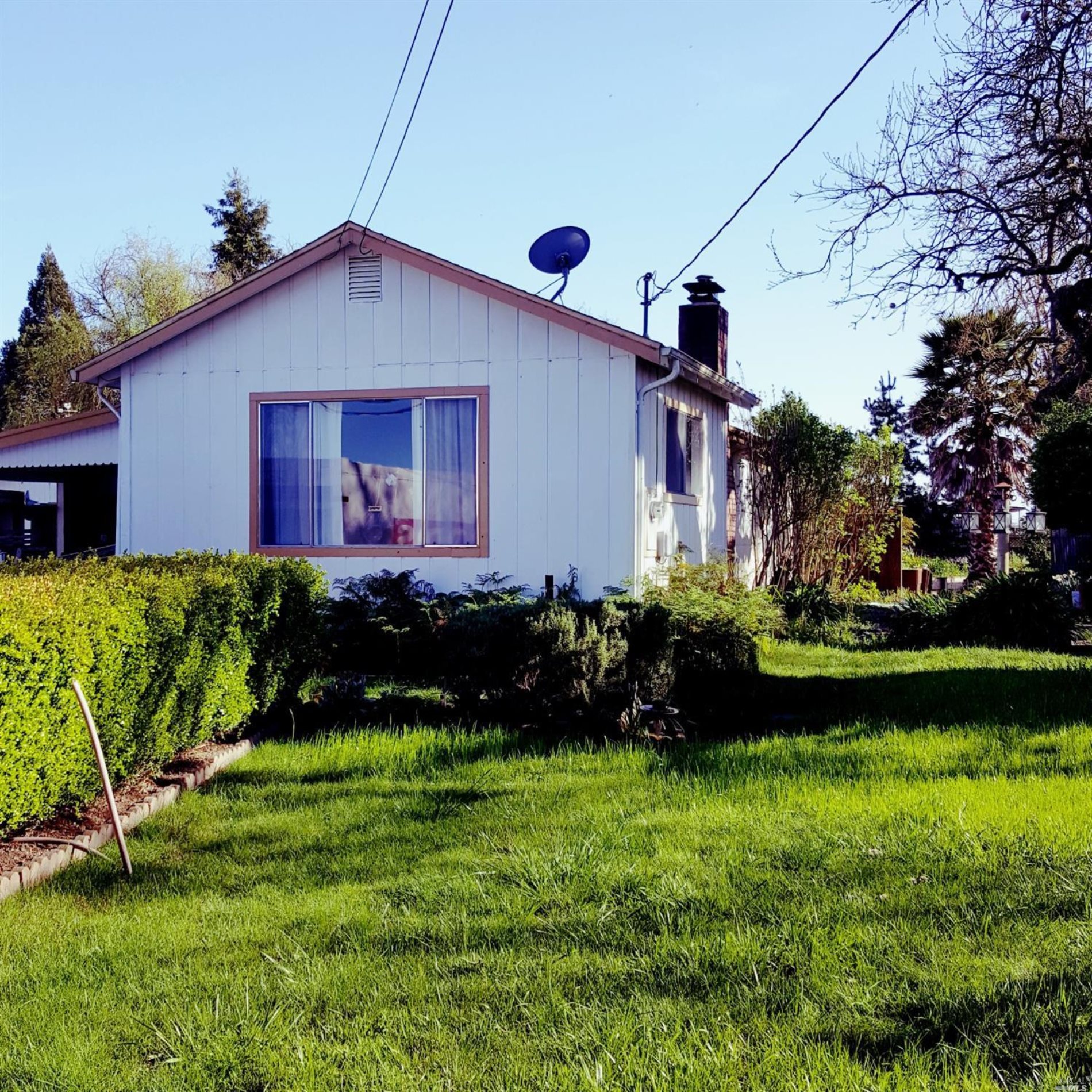 3972 West Olivet Road Santa Rosa, CA 95401 - Photo 1 of 1 a front view of a house with a yard