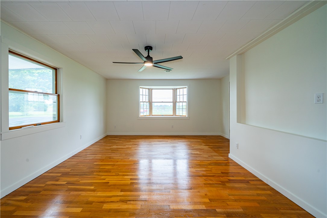 11296 Pansing Road Brookville, OH 45309 - Photo 4 of 53 Bright and airy living space featuring warm hardwood floors and abundant natural light.