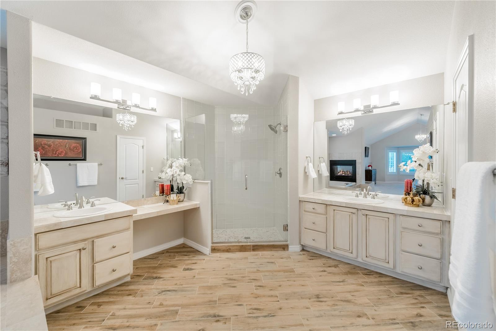 10734 Cougar Ridge Lone Tree, CO 80124 - Photo 13 of 35 a spacious bathroom with a double vanity sink mirror and