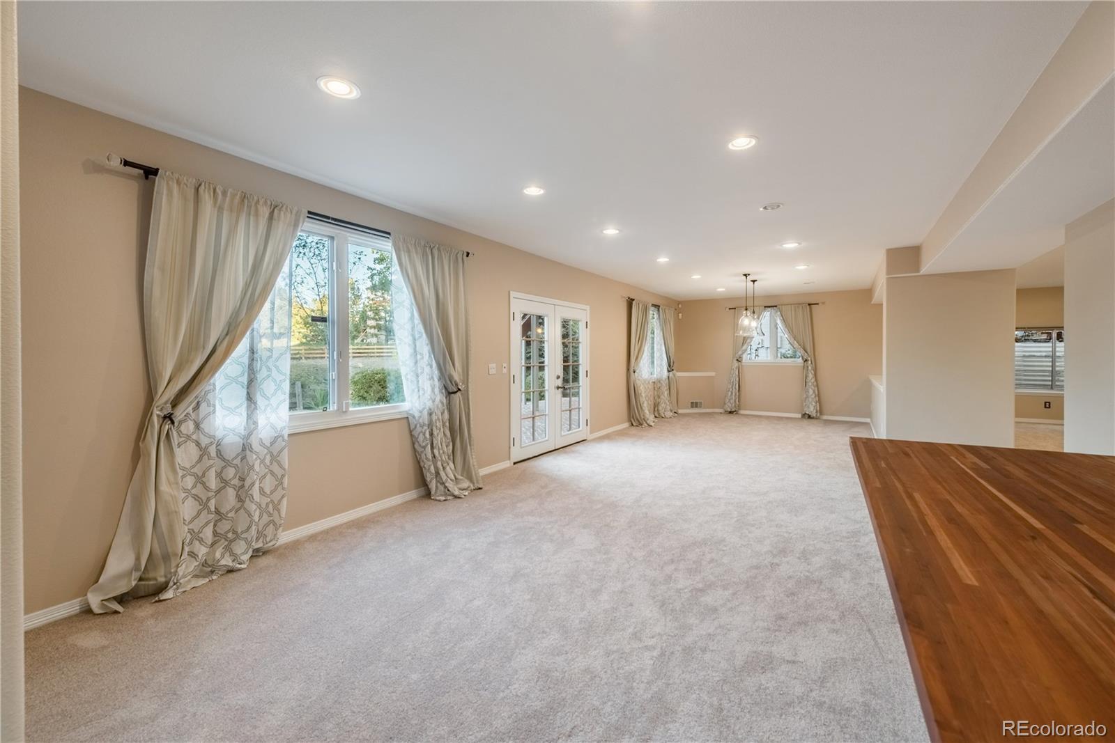 10734 Cougar Ridge Lone Tree, CO 80124 - Photo 26 of 35 a view of empty room with wooden floor and fan