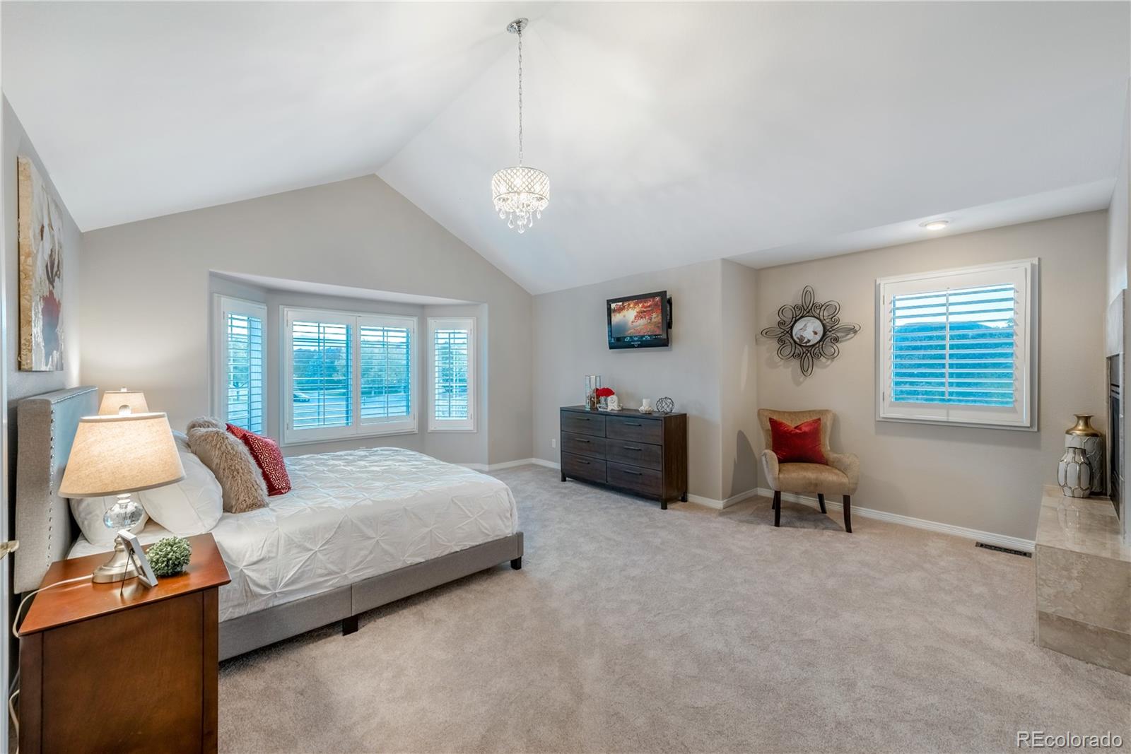 10734 Cougar Ridge Lone Tree, CO 80124 - Photo 9 of 35 a bedroom with bed and a large window