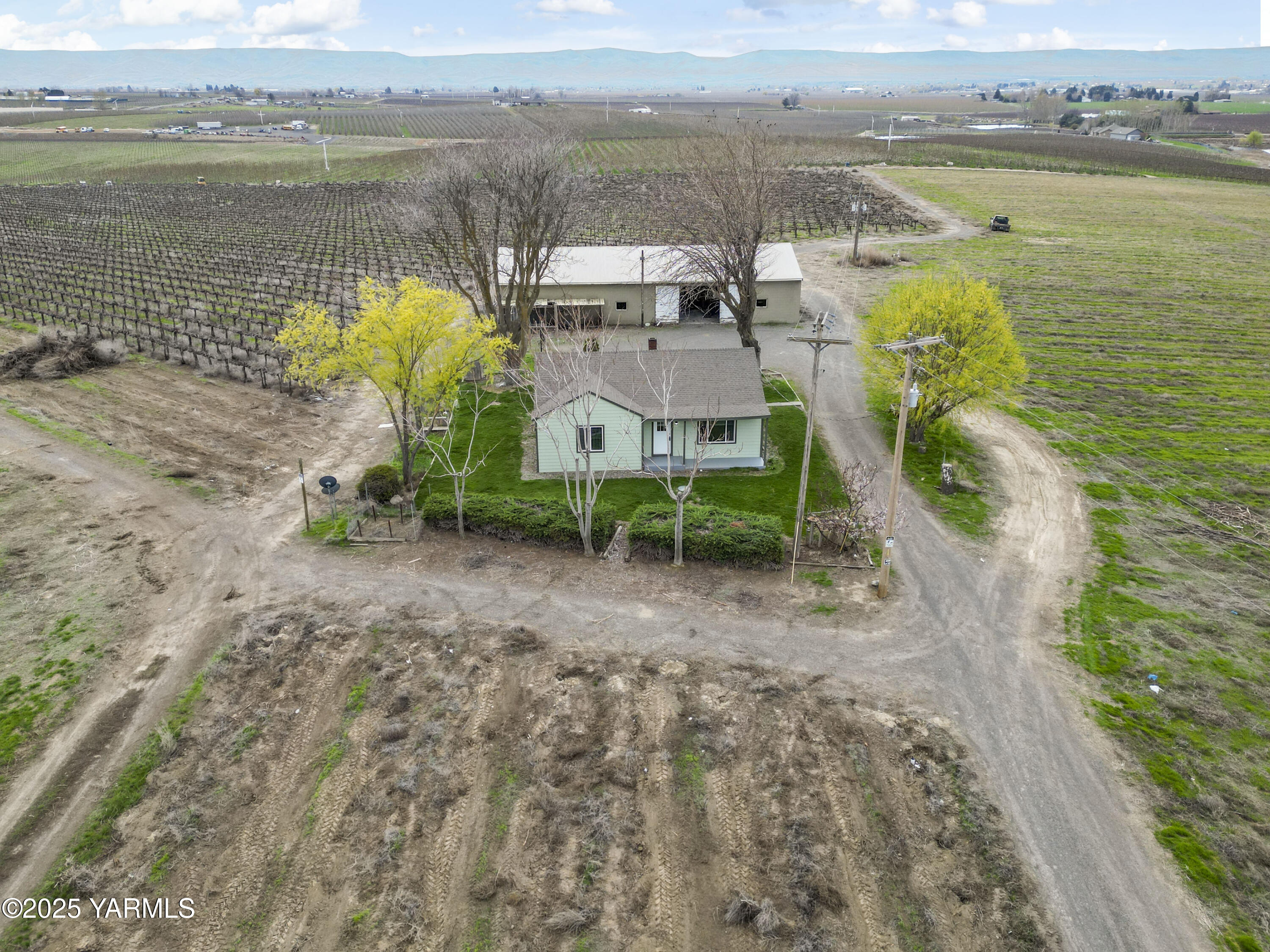173801 Evans Road Grandview, WA 98930 - Photo 1 of 45 a view of a lake with a mountain in the background