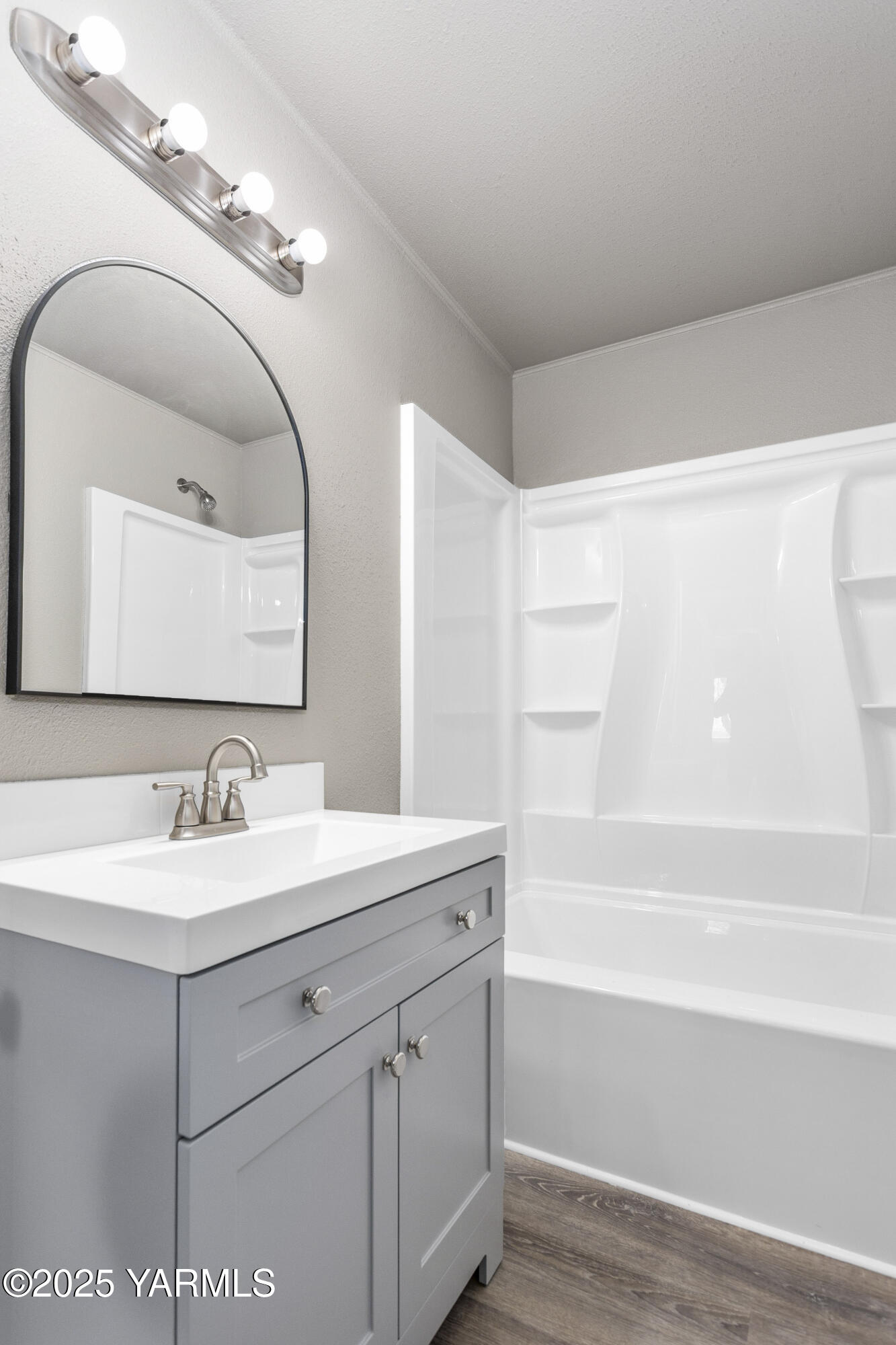 173801 Evans Road Grandview, WA 98930 - Photo 11 of 45 a bathroom with a sink and a mirror