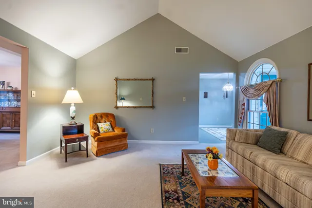 a bedroom with furniture and a lamp