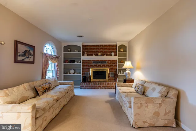 a view of a livingroom with a furniture wooden floor and a chandelier