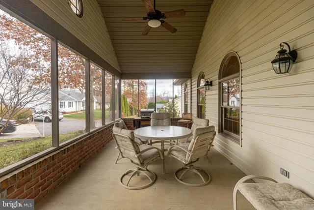 a dining room with furniture water view and a large window