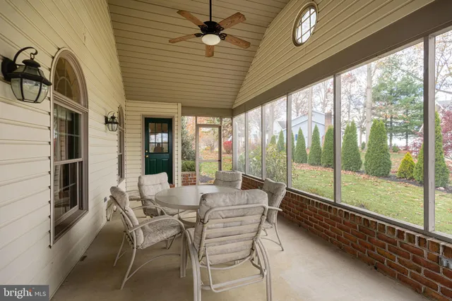 a kitchen with granite countertop wooden cabinets and stainless steel appliances