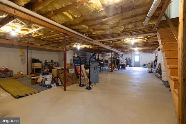 a view of gym equipment with racks