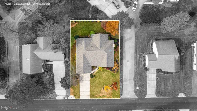 a view of a house with a small yard and plants