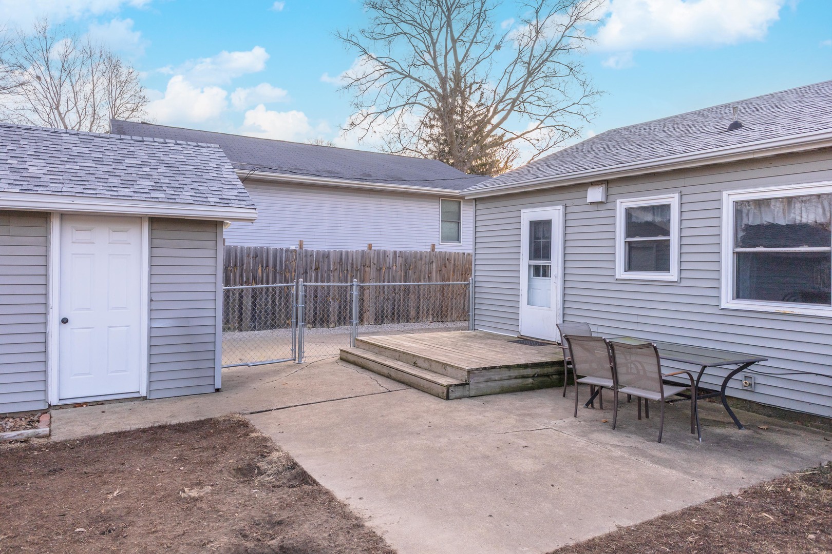 334 East Baker Street Bloomington, IL 61701 - Photo 12 of 32 a view of a house with a backyard and chairs