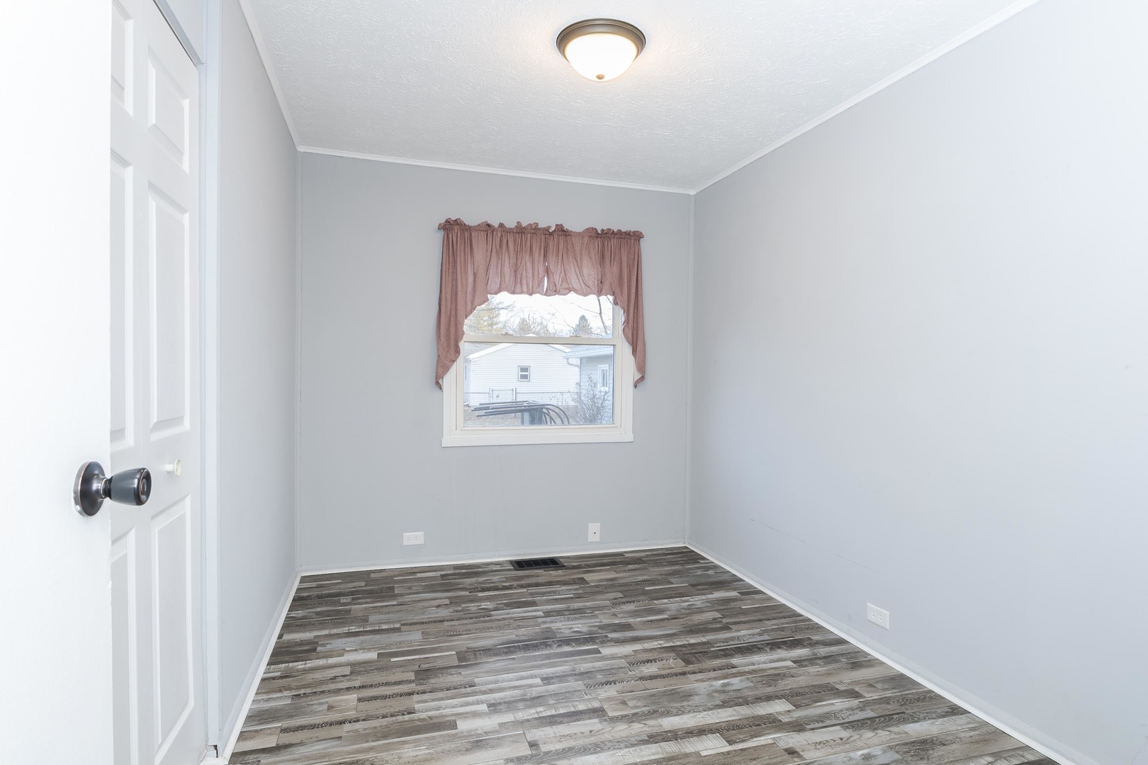 334 East Baker Street Bloomington, IL 61701 - Photo 15 of 32 a view of a hallway with wooden floor and closet