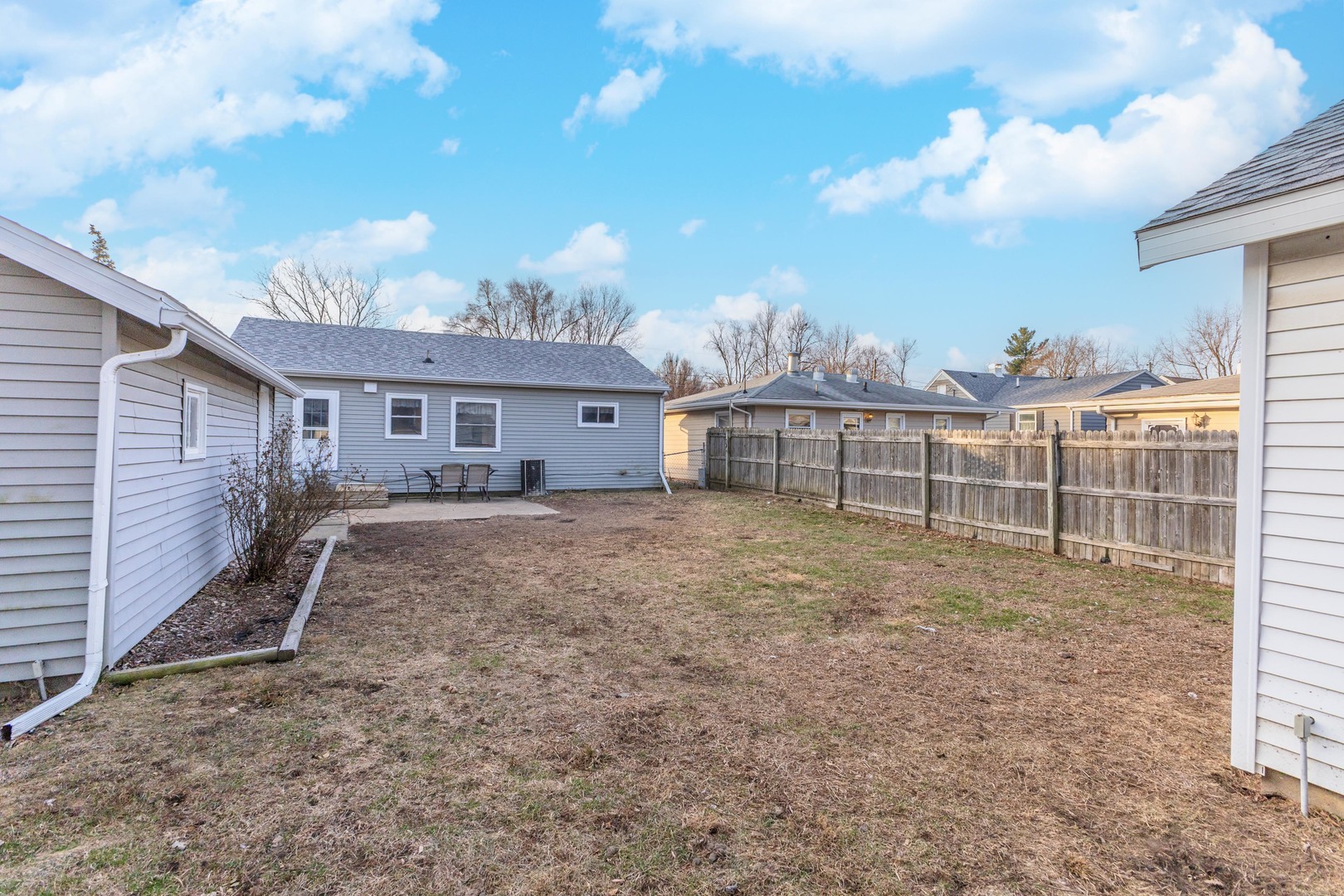 334 East Baker Street Bloomington, IL 61701 - Photo 26 of 32 a view of a house with a backyard