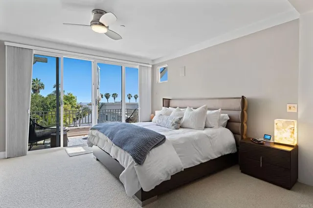 a bedroom with a large bed and a large window