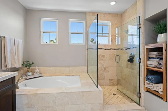 a bathroom with a bathtub and a shower