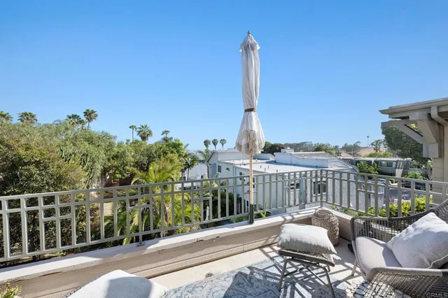 a view of a balcony with furniture