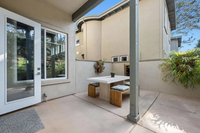 a view of kitchen with stainless steel appliances granite countertop sink and cabinets