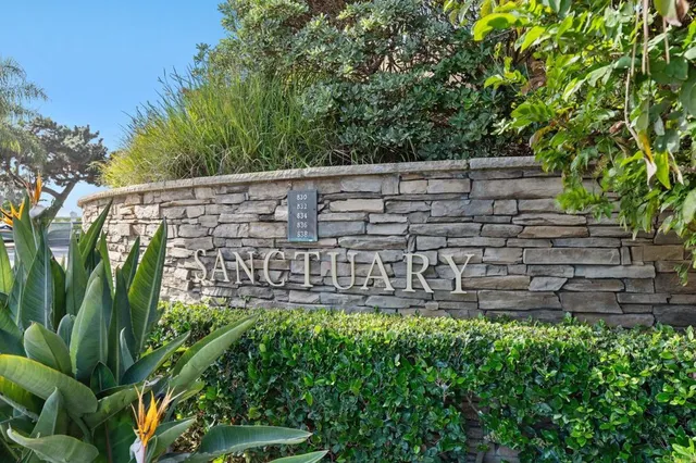 a view of a white building among the street