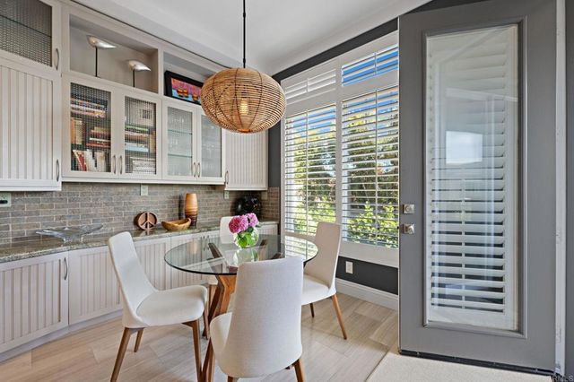 a dining room with furniture and window