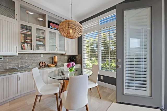 a dining room with furniture and window