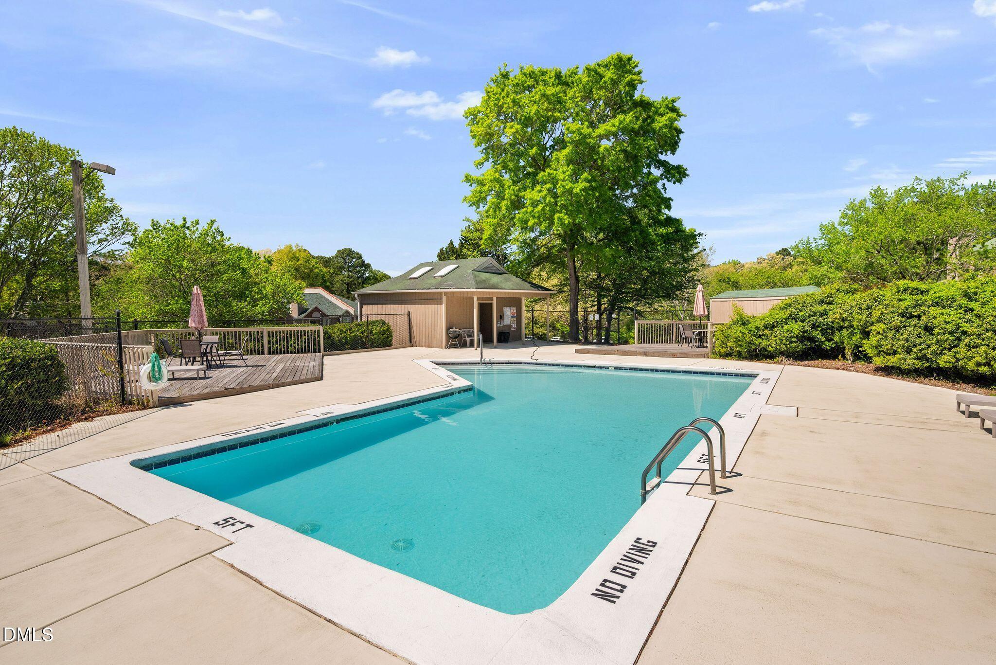 3704 Chimney Ridge Place, Unit 207 Durham, NC 27713 - Photo 22 of 31 a view of swimming pool with a garden