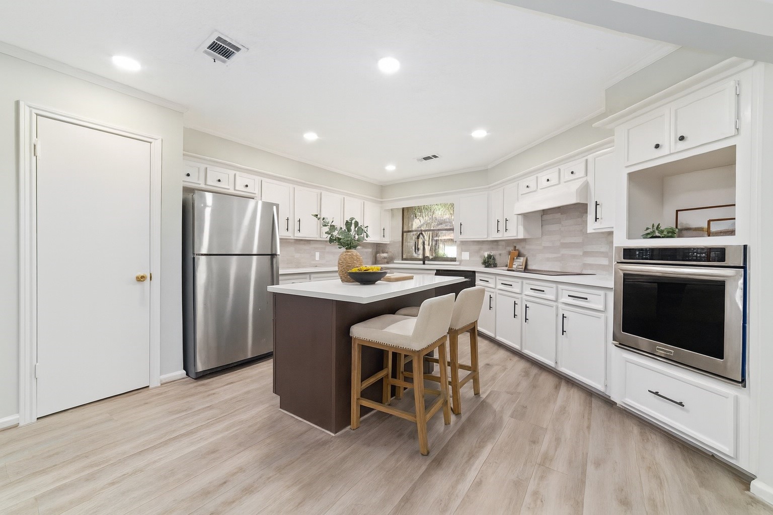 154 Old Bridge Lake Street Houston, TX 77069 - Photo 1 of 30 a kitchen with a refrigerator a sink and a stove top oven