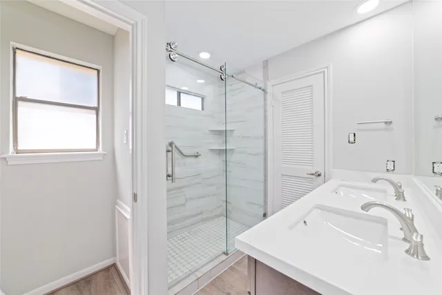 a en suite bathroom with a sink and a shower