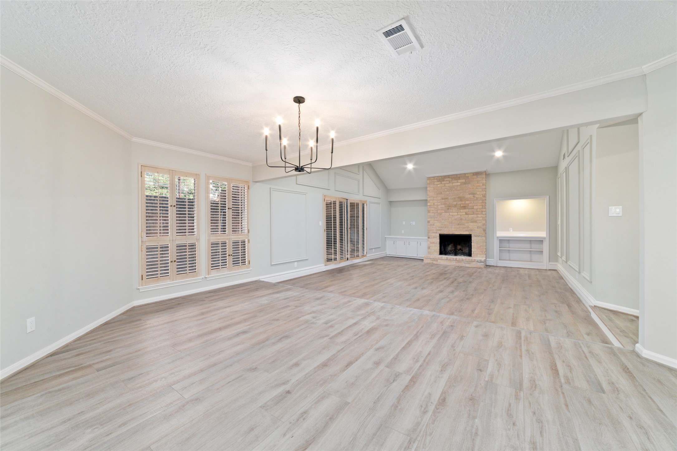 154 Old Bridge Lake Street Houston, TX 77069 - Photo 25 of 30 a view of empty room with wooden floor and fireplace