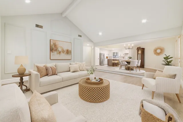 a living room with furniture and a lamp