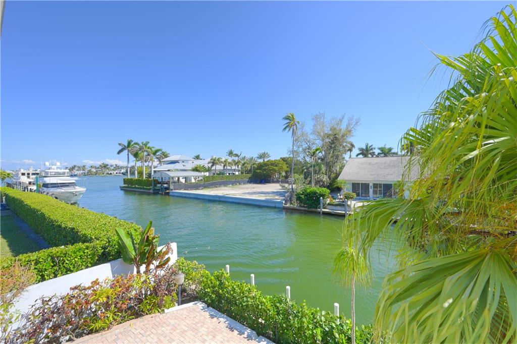 an aerial view of a house with a lake view