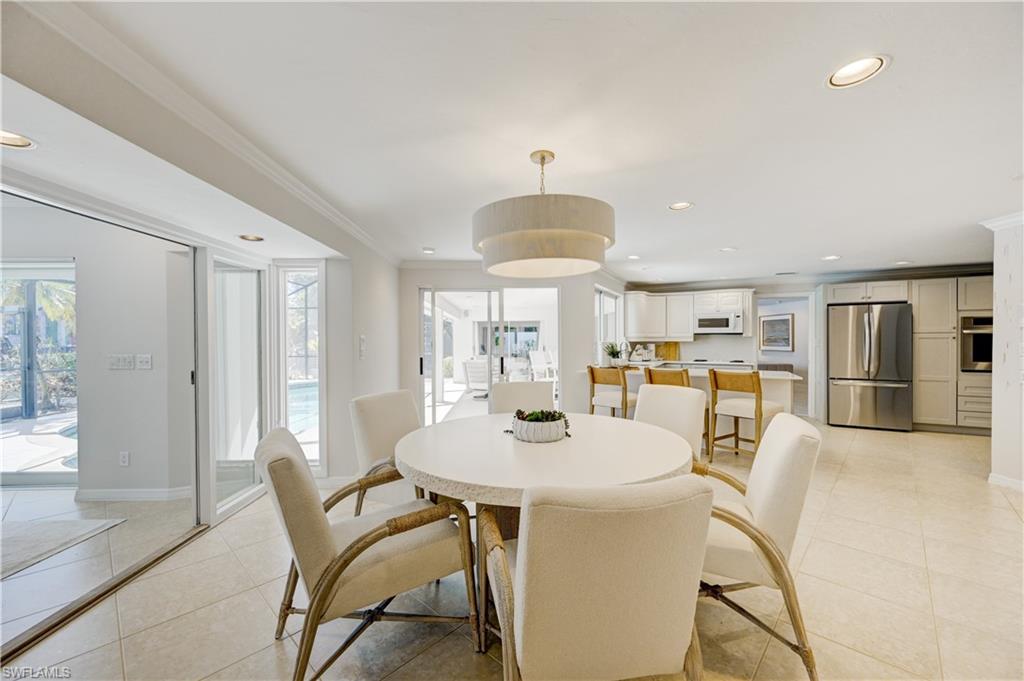 660 14th Avenue South Naples, FL 34102 - Photo 12 of 50 a dining room with furniture and window