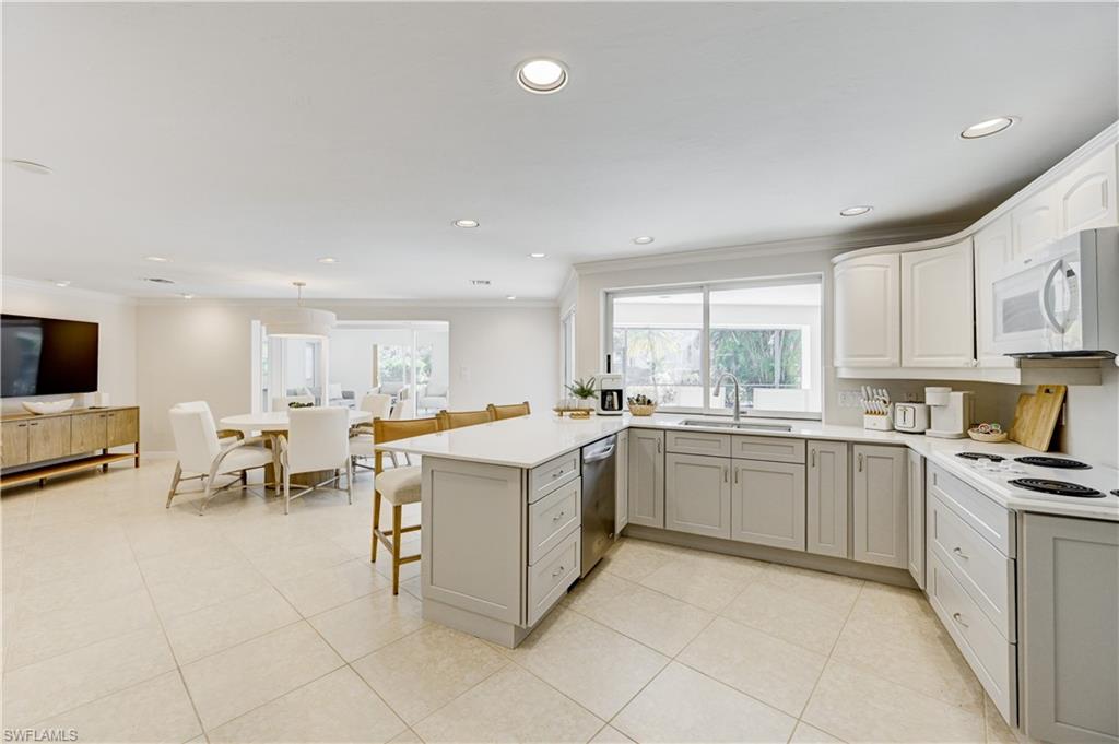 660 14th Avenue South Naples, FL 34102 - Photo 14 of 50 a kitchen with a sink and counter top space