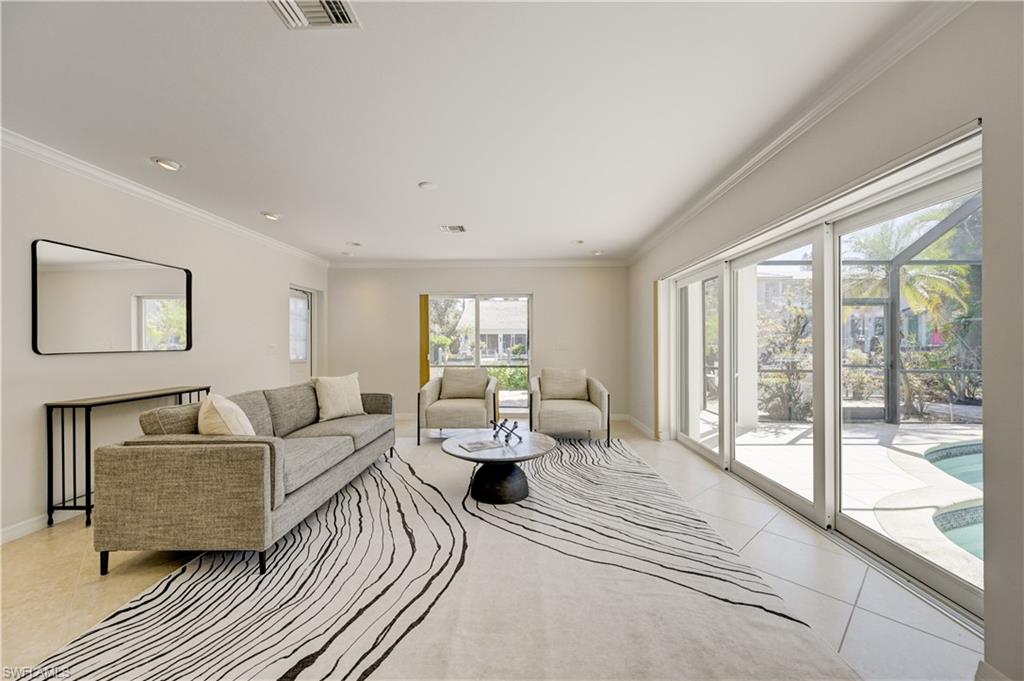 660 14th Avenue South Naples, FL 34102 - Photo 17 of 50 a living room with furniture and a large window