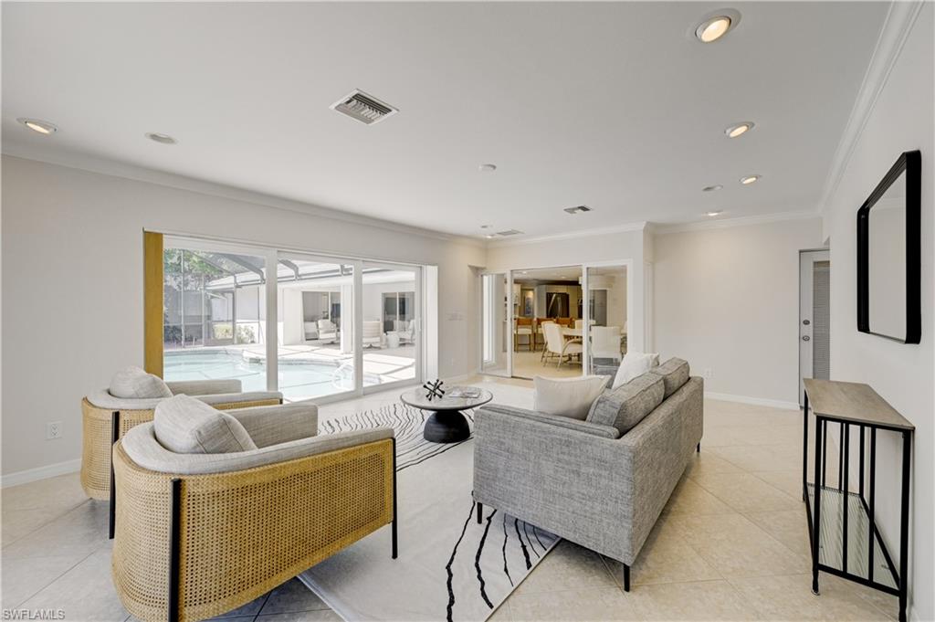 660 14th Avenue South Naples, FL 34102 - Photo 18 of 50 a living room with furniture and a window