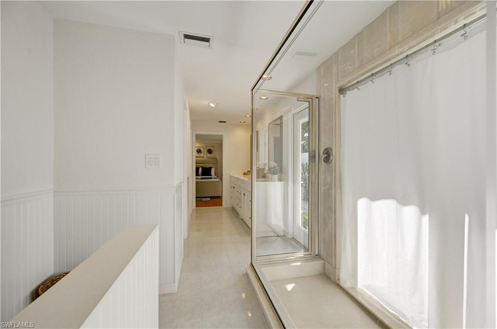 660 14th Avenue South Naples, FL 34102 - Photo 30 of 50 a view of a hallway with a wooden door