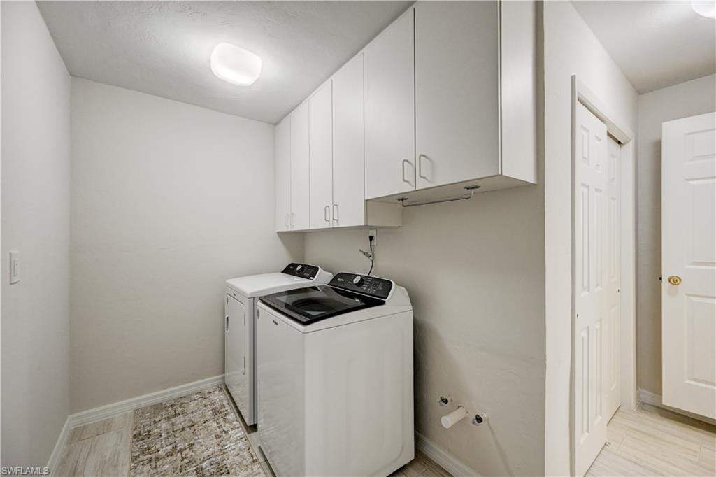 660 14th Avenue South Naples, FL 34102 - Photo 35 of 50 a kitchen with a sink and cabinets