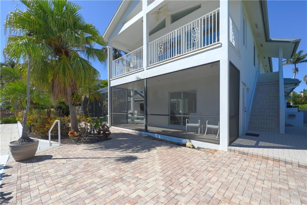 660 14th Avenue South Naples, FL 34102 - Photo 36 of 50 a view of a house with a patio