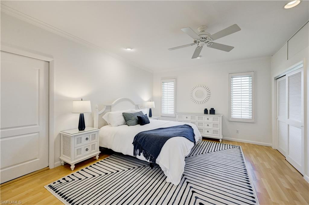 660 14th Avenue South Naples, FL 34102 - Photo 44 of 50 a bedroom with double bed and a window