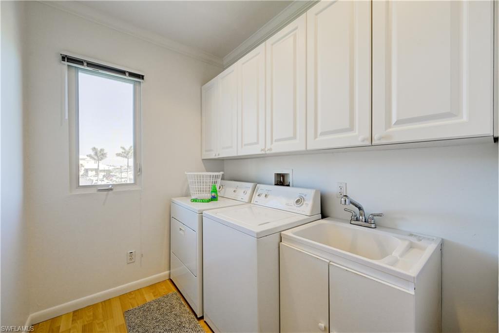 660 14th Avenue South Naples, FL 34102 - Photo 47 of 50 a utility room with dryer and washer